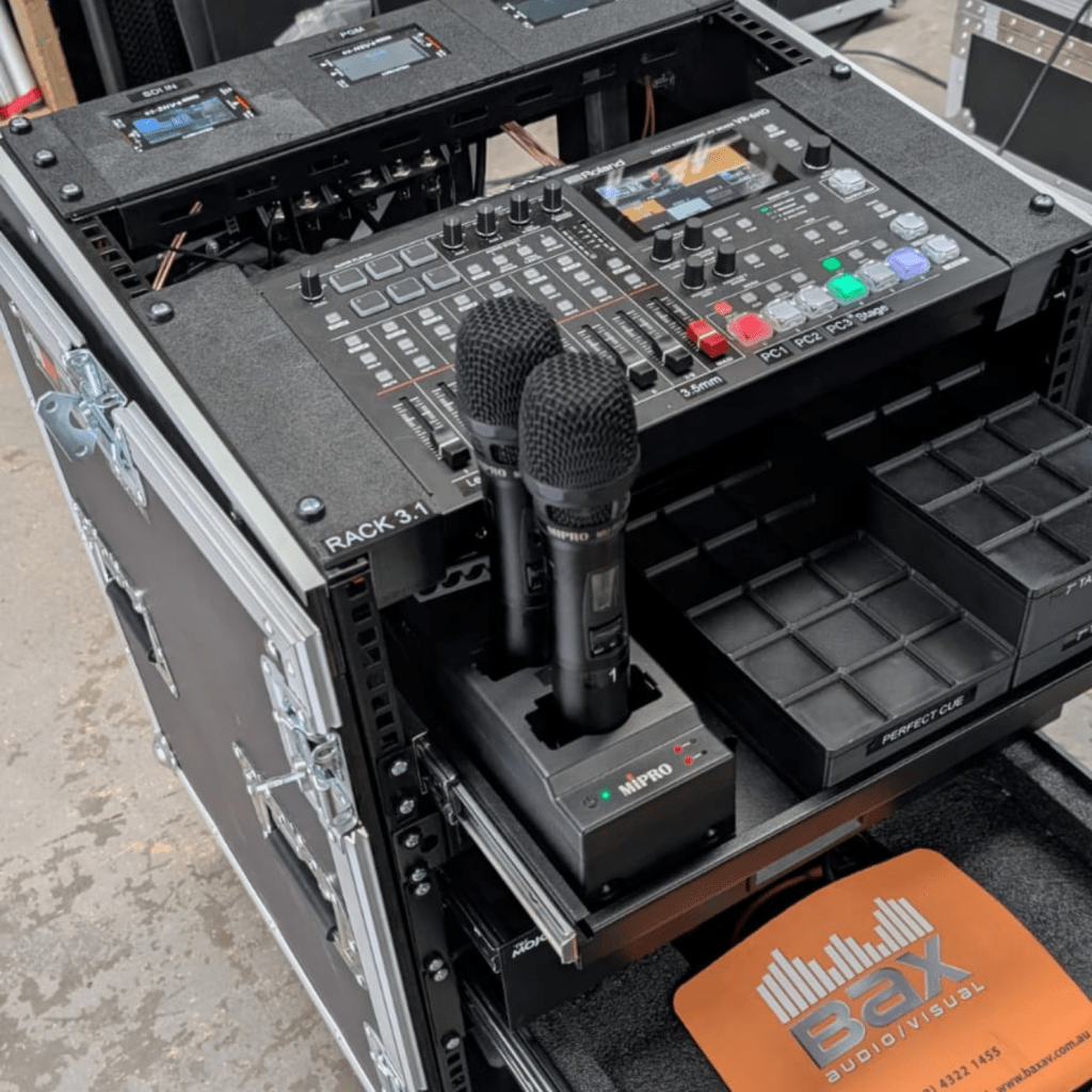 Bump-in AV control box custom-built by Bax AV, mounted on a wall with neatly labelled ports and switches for power, audio and visual input. Compact, professional design suited for fast and efficient setup in event or venue environments.